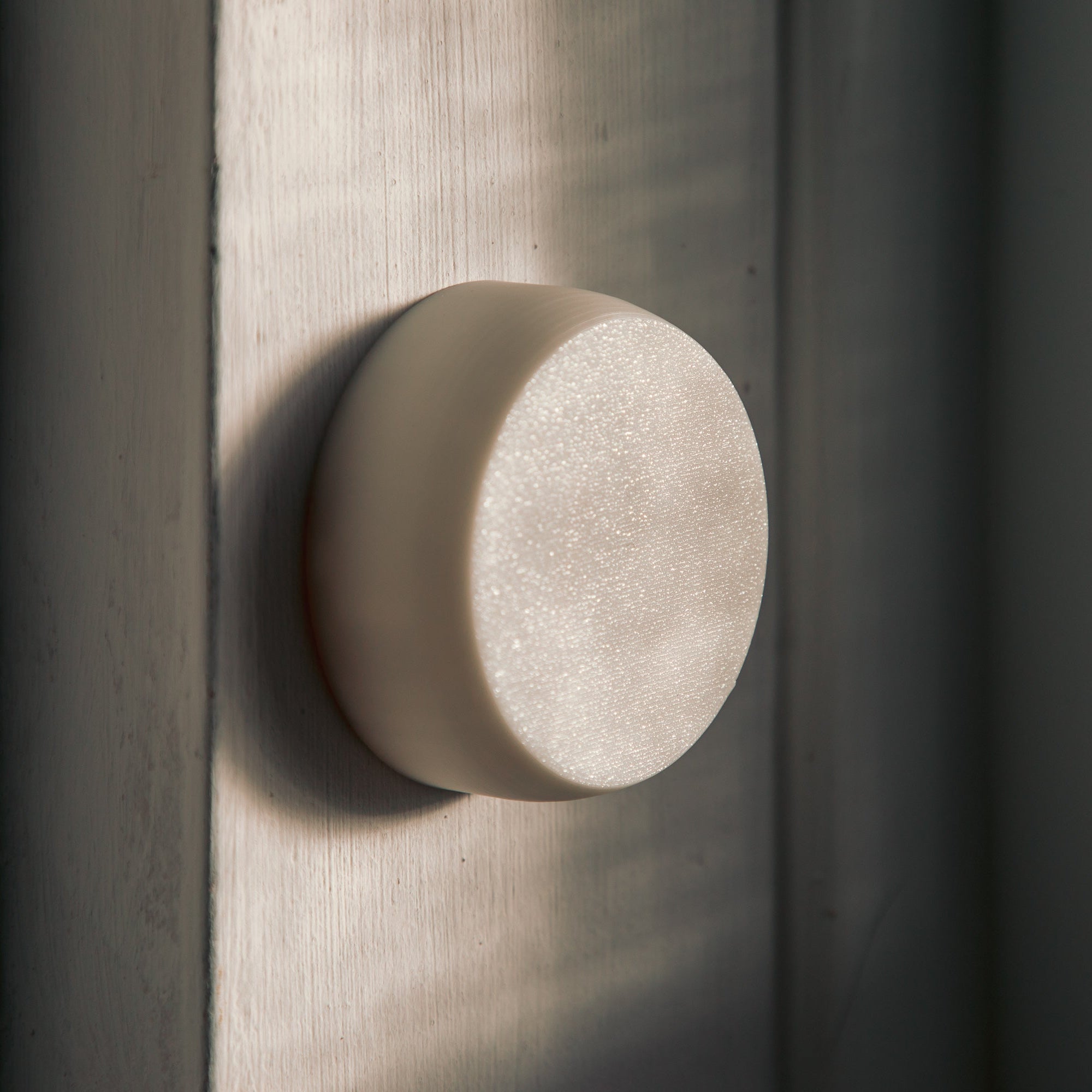 Close-up of AIRaware on a wooden window frame.